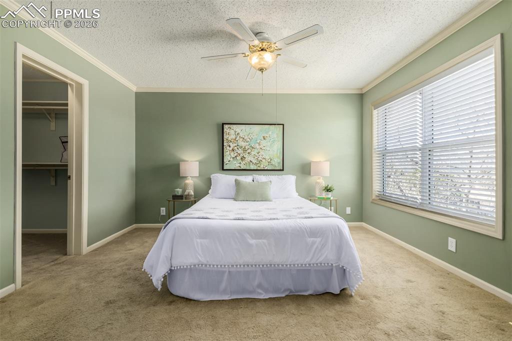 Image 13 of 30: Bedroom with a walk in closet amd emsuite bathroom
