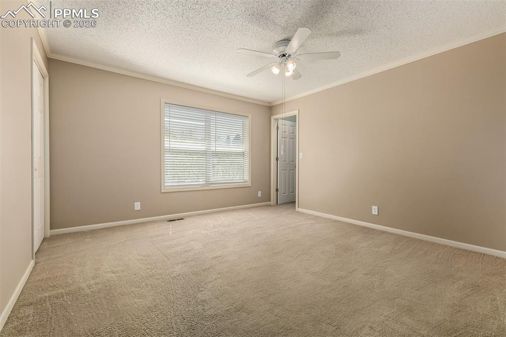 Image 18 of 30: Large guest bedroom with two walk-in closets
