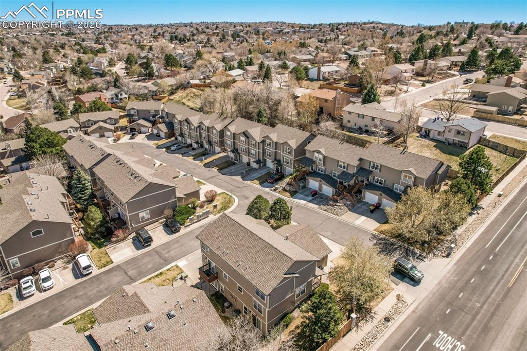 Image 27 of 30: Aerial view of property and surrounding area featuring nearby suburban area