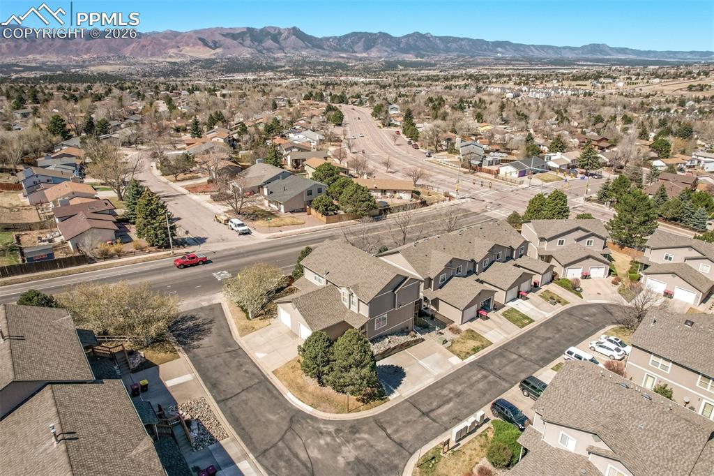 Image 29 of 30: View of property location featuring nearby suburban area and a mountainous 