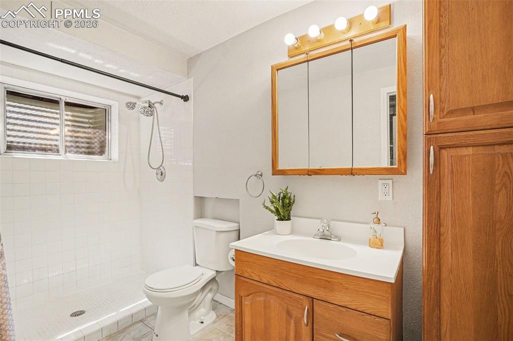 Image 15 of 25: 3/4 bathroom in basement.