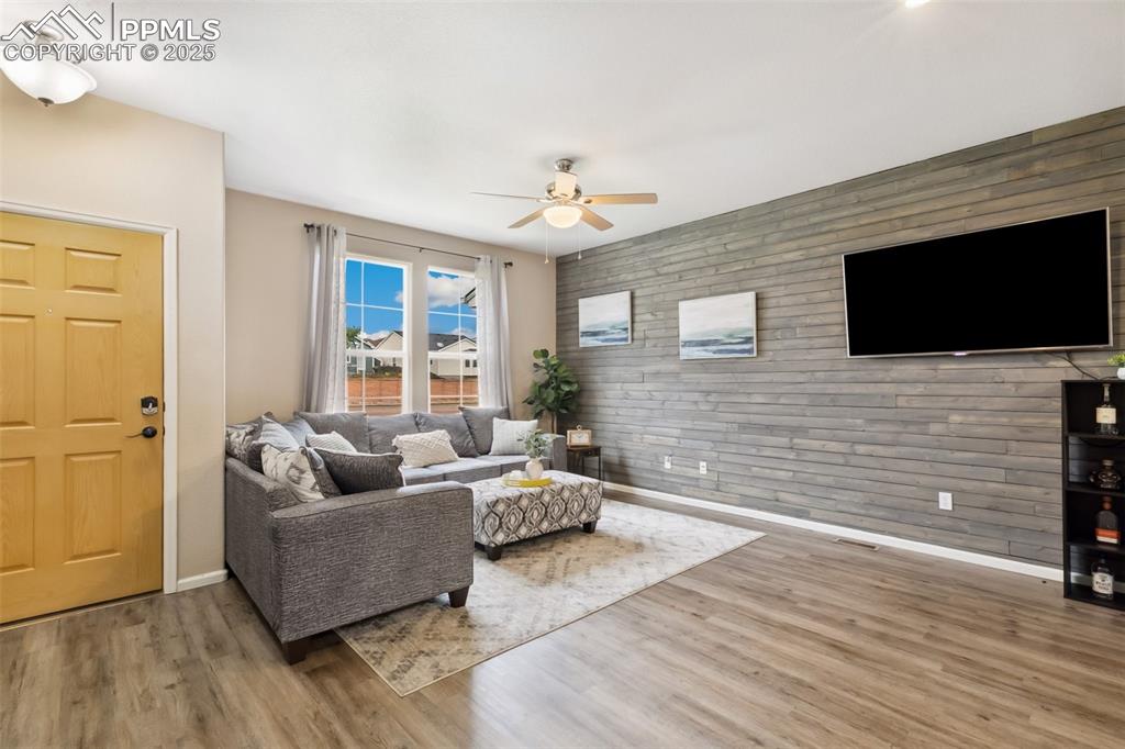 Image 3 of 29: Entryway & Relaxing Living Room