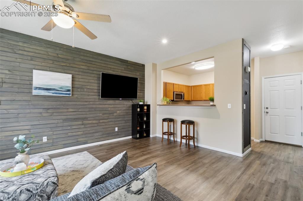 Image 4 of 29: Living Room & Dining Area w/ Breakfast Bar