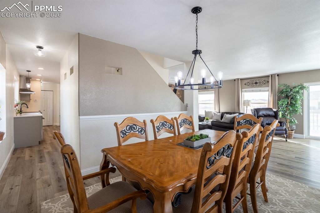 Image 12 of 50: Showing pass through to the kitchen.