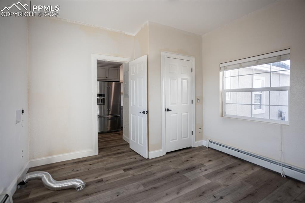 Image 39 of 50: Large laundry area, flexible space for dogs or home office. Painting in pro