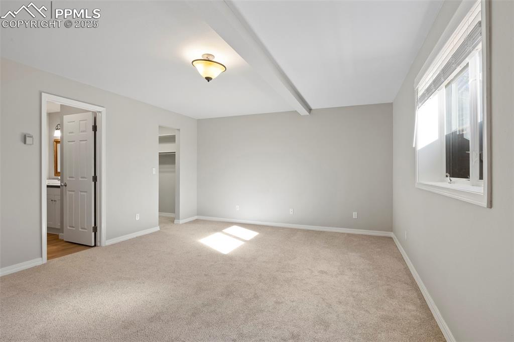 Image 19 of 35: Basement bedroom with ensuite and walk in closet