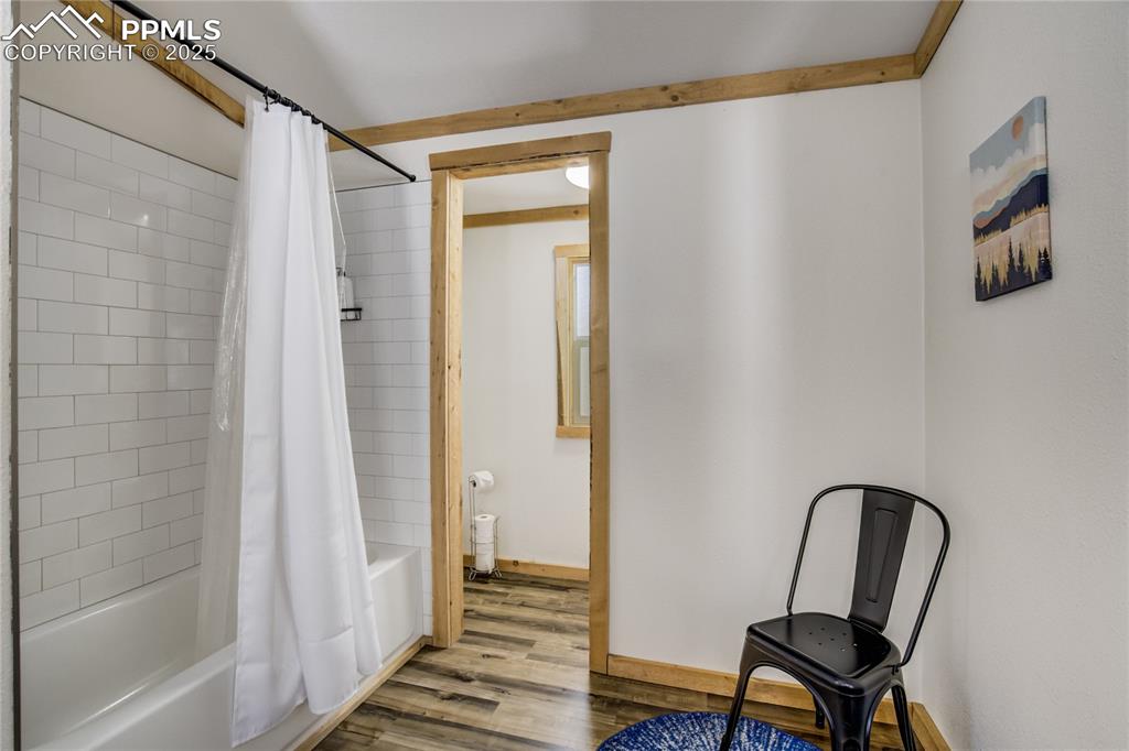 Image 37 of 50: 2nd home - Primary bathroom with shower/bath combo with dressing area and L