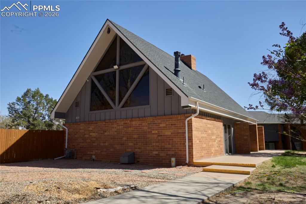 Image 24 of 28: View of swimming pool with a fenced in pool and patio area