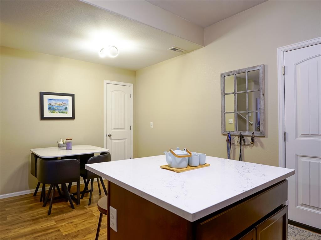 Image 8 of 31: Kitchen and Dining View 1