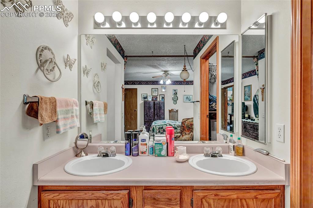 Image 12 of 21: Double sinks and bright lighting make mornings easy — everything you need f
