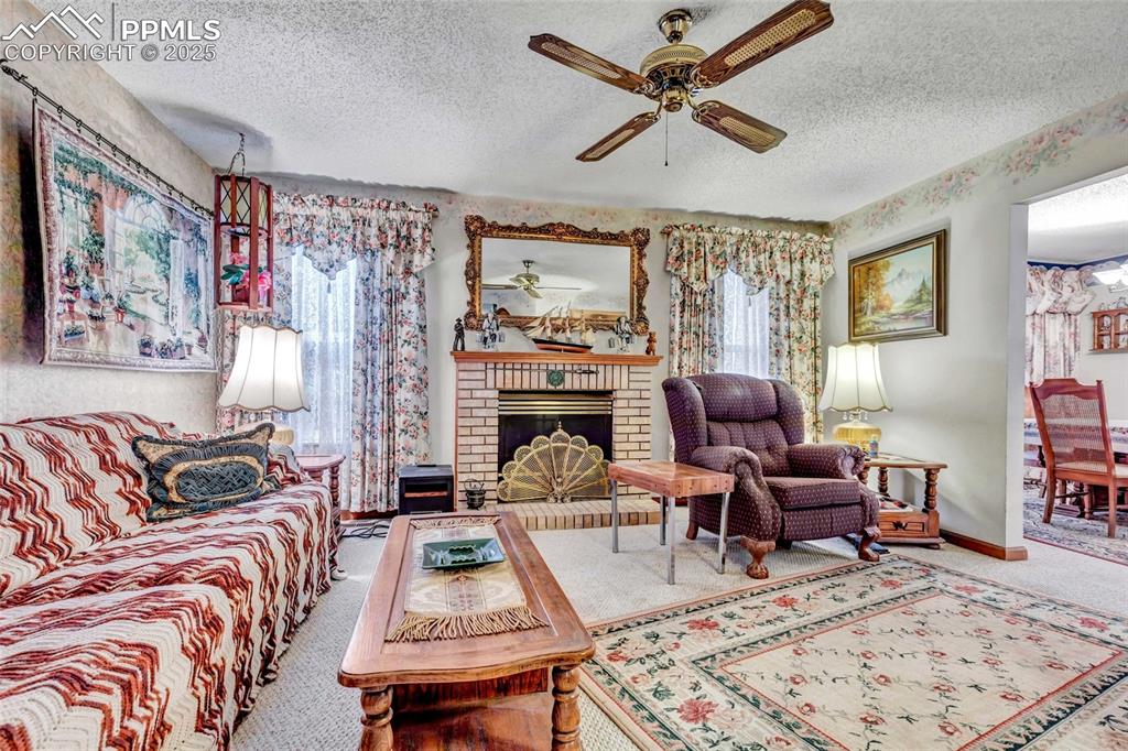 Image 3 of 21: A comfy, light-filled living room made for relaxing nights in and friendly