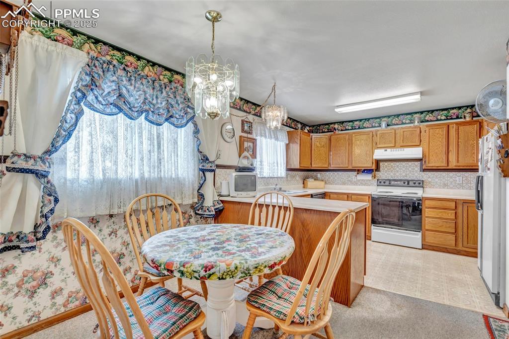 Image 8 of 21: Charming breakfast nook filled with light and warmth — the perfect spot to