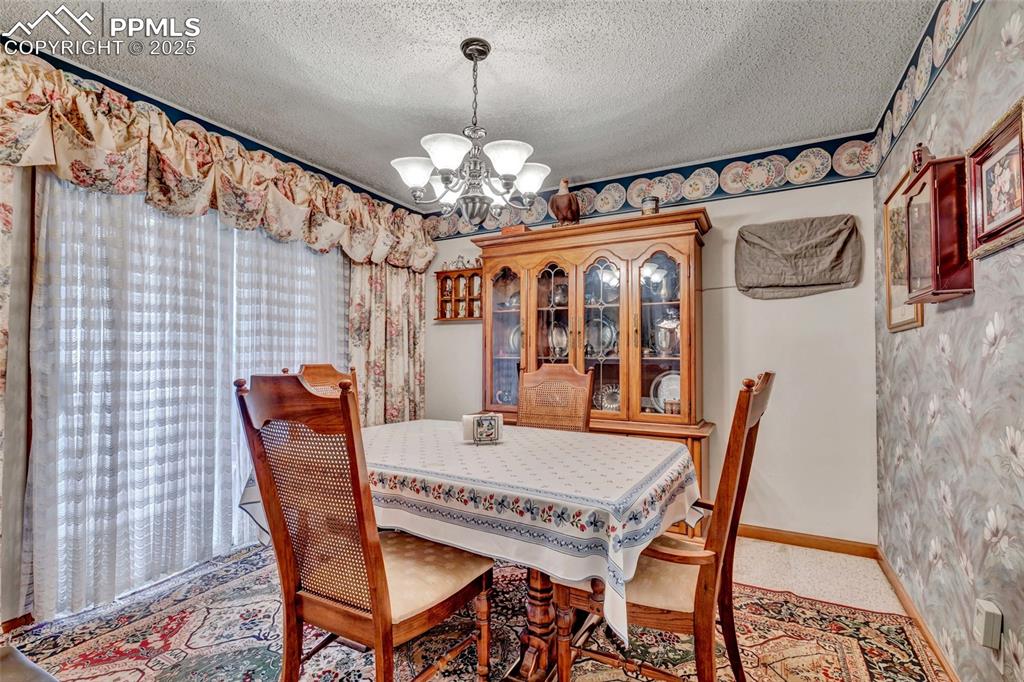 Image 9 of 21: This dining space was made for gathering — plenty of natural light, a great
