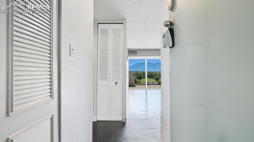 Image 17 of 31: Hallway into the Living Room.