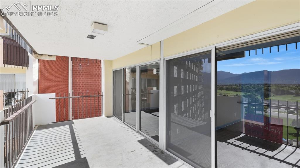 Image 25 of 31: Expanded balcony with walk outs from the Living Room and Primary Bedroom.