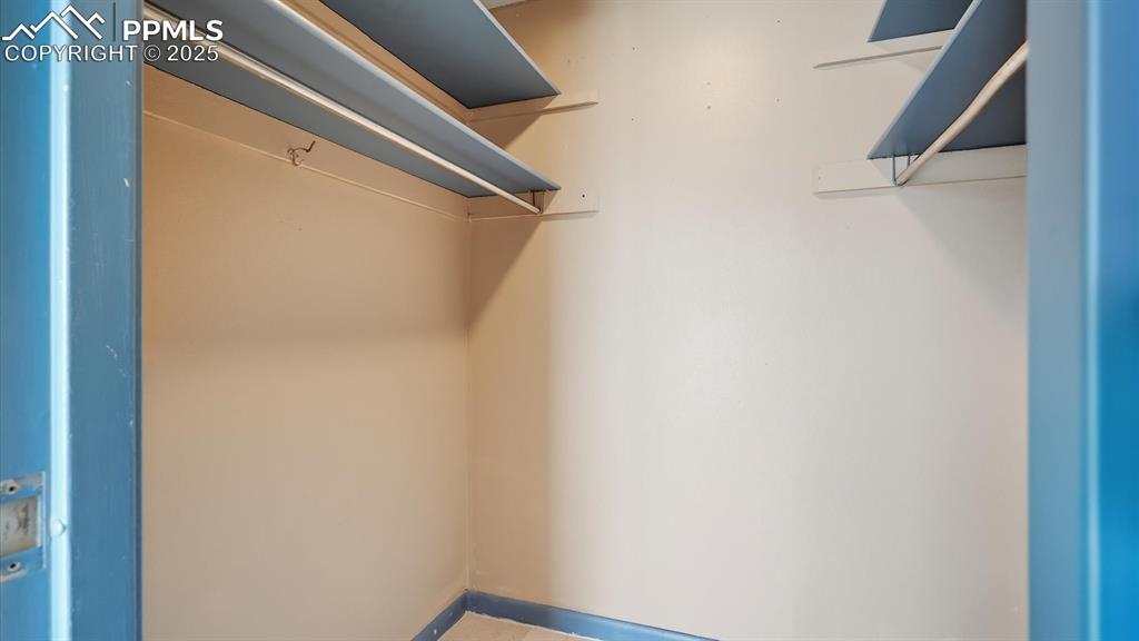 Image 28 of 31: Walk-in closet.