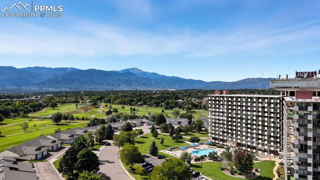 Image 5 of 31: Aerial view of the complex, grounds, golf course, and Pikes Peak.