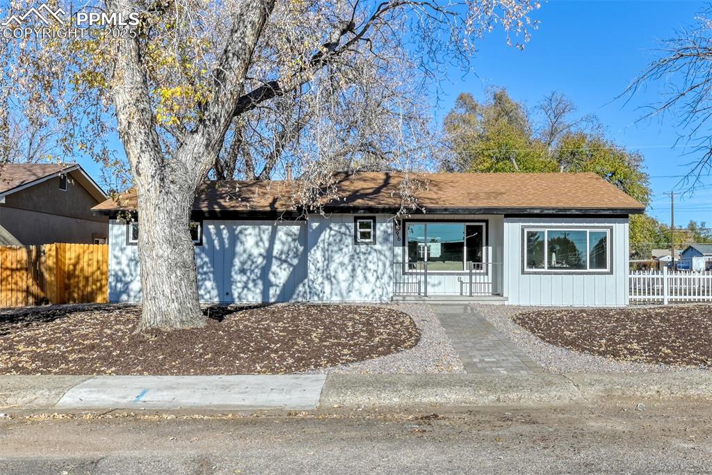 Image 2 of 48: Ranch-style home with a shingled roof