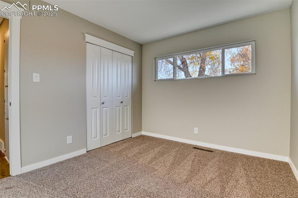 Image 39 of 48: Unfurnished bedroom with carpet floors and a closet