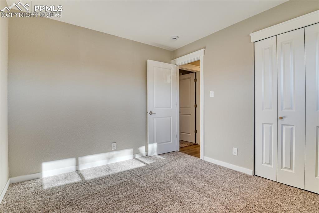 Image 40 of 48: Unfurnished bedroom featuring carpet floors and a closet