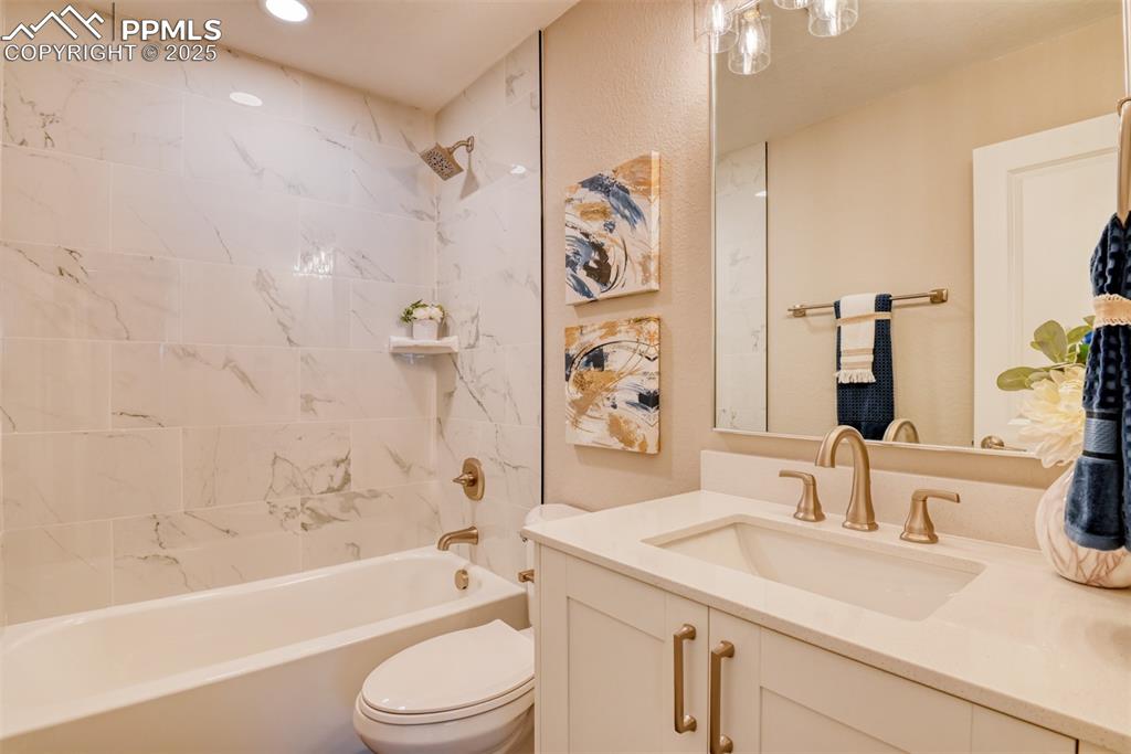 Image 42 of 48: Full bath featuring vanity and bathing tub / shower combination