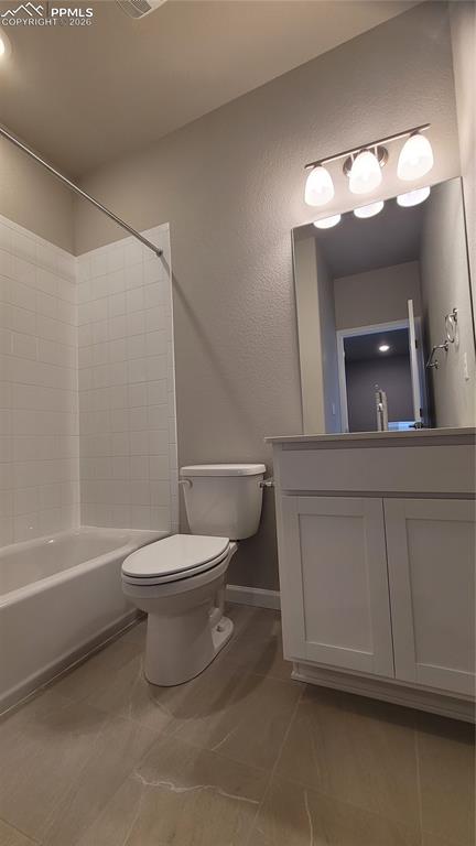 Image 24 of 26: Full Bathroom with quartz countertop and tile surround! 