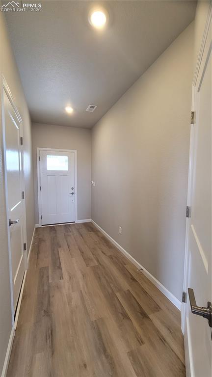 Image 3 of 26: Welcome Home! Inviting Entryway with LVP flooring and access to the garage!