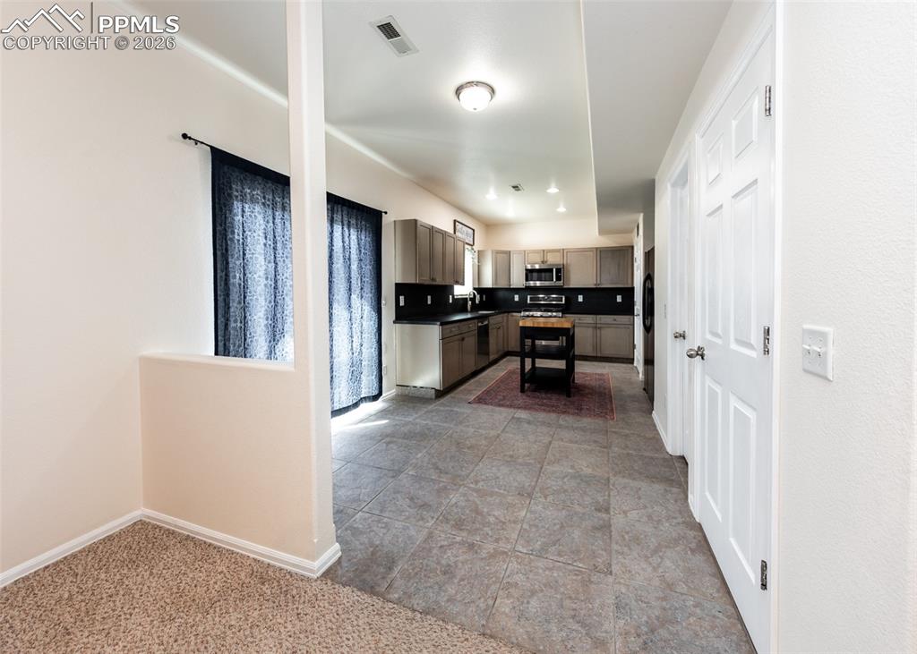 Image 10 of 50: 12x20 Kitchen includes eat-in dining area w/sliding door to deck!