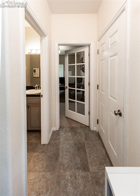 Image 18 of 50: Hall to main-level office!