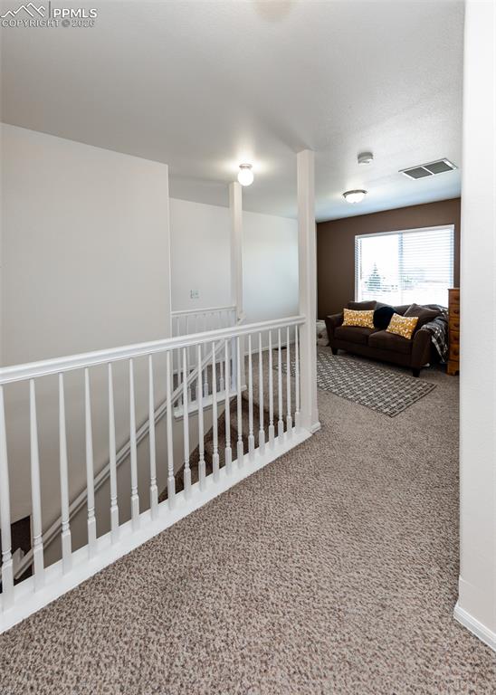 Image 23 of 50: 12x12 loft area at the top of the stairs!