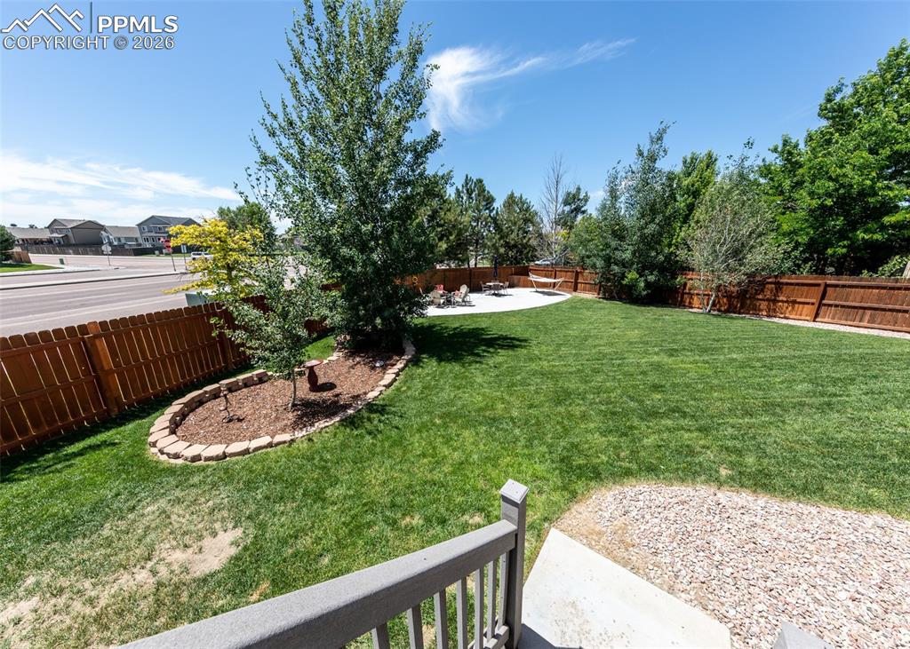 Image 46 of 50: Large backyard with attached and detached storage! Summer!