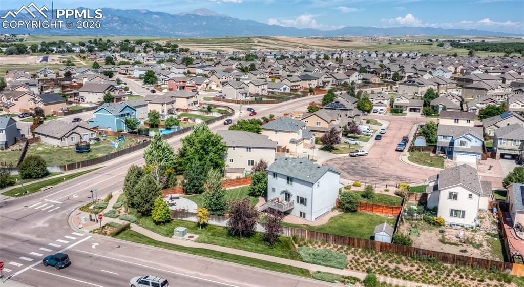 Image 49 of 50: View of home with large backyard! Summer!