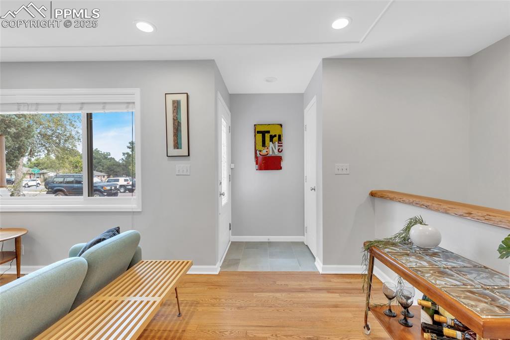 Image 10 of 50: Foyer with light wood-style floors and recessed lighting
