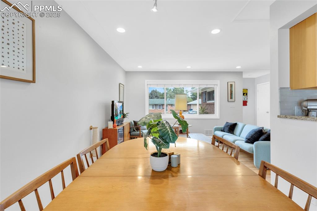 Image 14 of 50: Dining room featuring recessed lighting