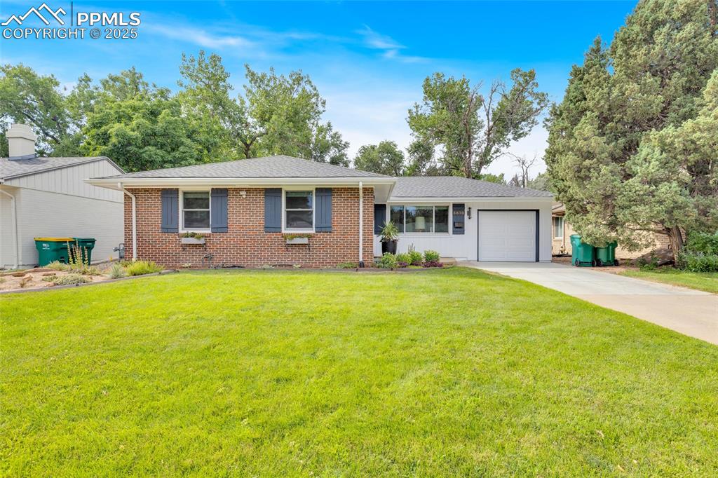 Image 2 of 50: Single story home with driveway, a garage, a front lawn, and a shingled roo