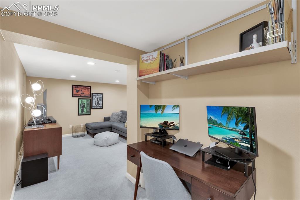 Image 27 of 50: Office space with carpet floors and recessed lighting