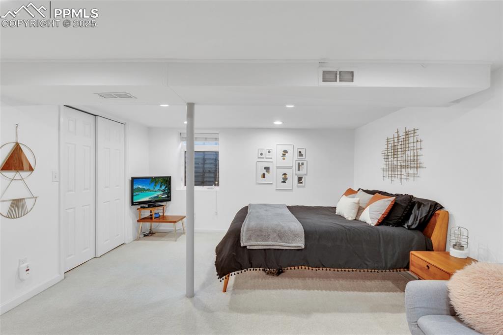 Image 31 of 50: Carpeted bedroom featuring recessed lighting and a closet