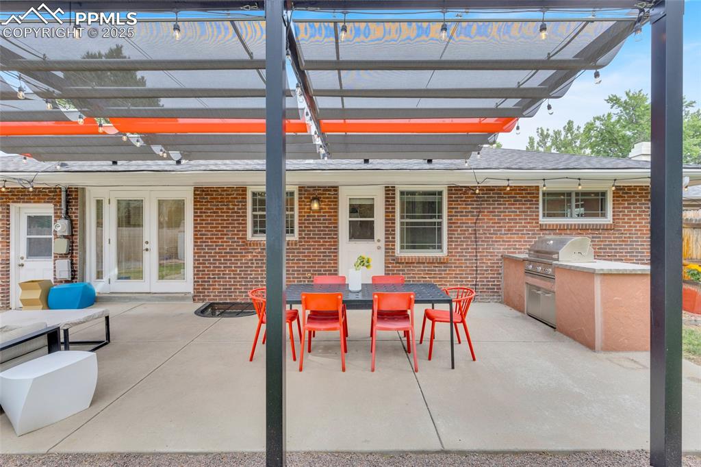 Image 42 of 50: View of patio / terrace featuring outdoor dining area, area for grilling, f