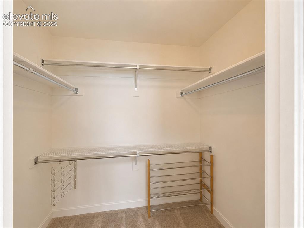 Image 17 of 31: Walk in closet in Primary bedroom
