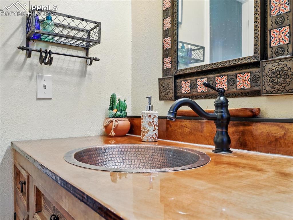 Image 25 of 45: Guest Bath with custom sink