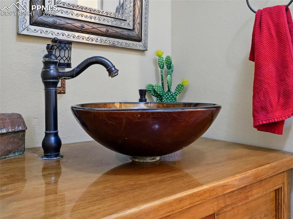 Image 26 of 45: Guest Bathroom with second custom sink 