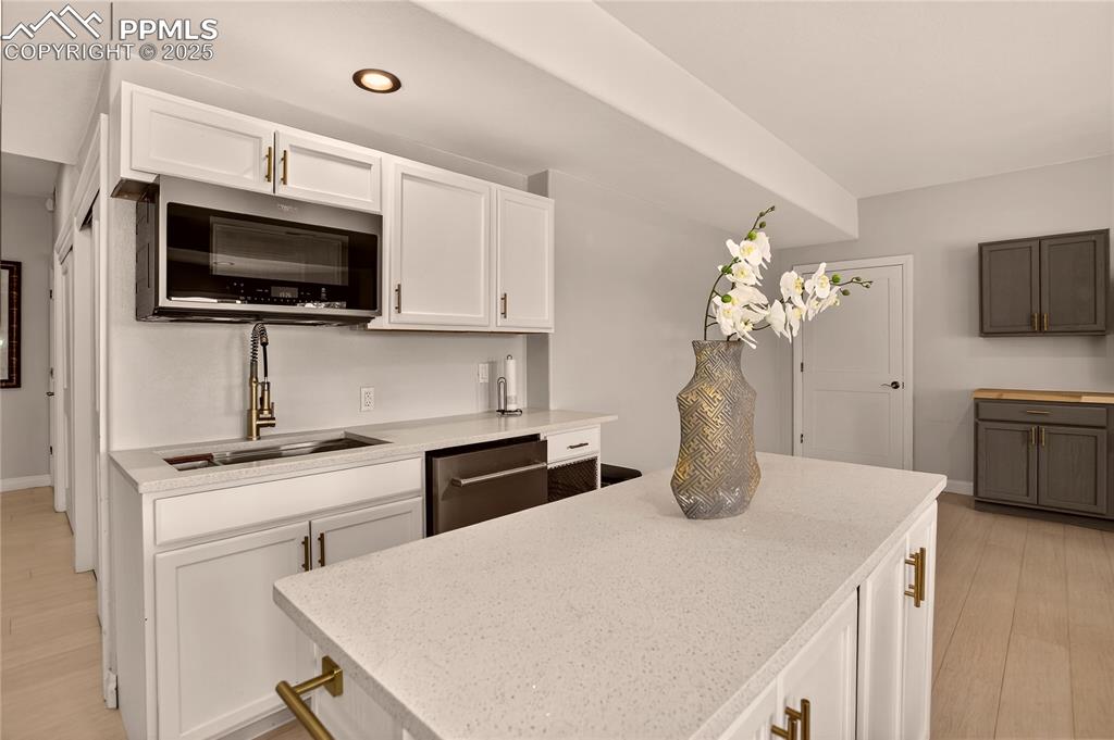 Image 29 of 46: Family room wet bar - lower level
