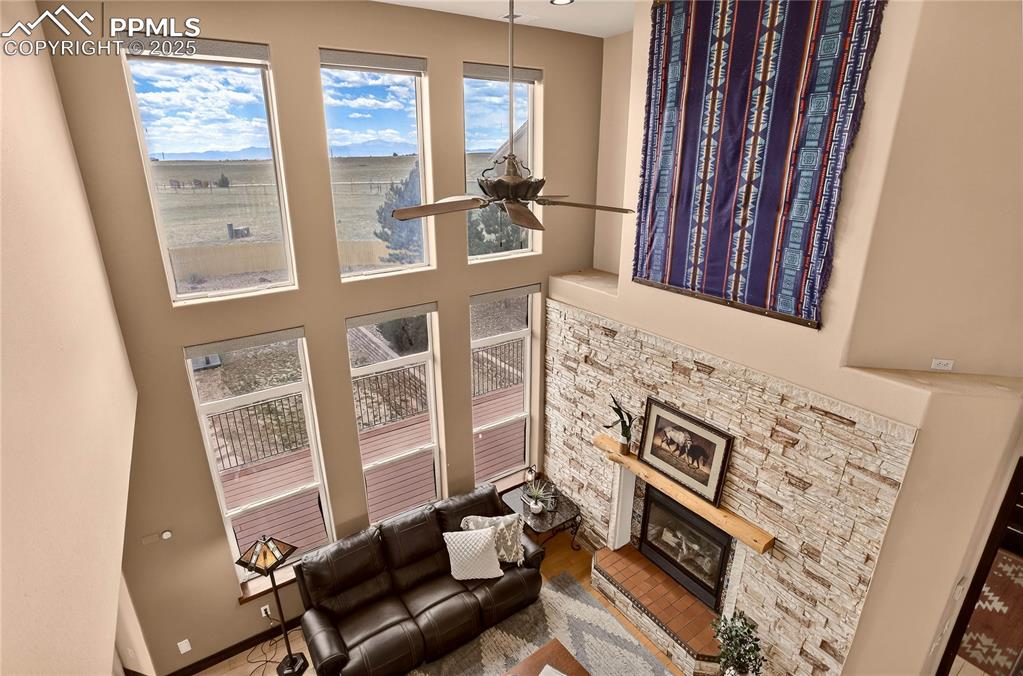 Image 4 of 46: 2-story windows in living room showcase Pikes Peak