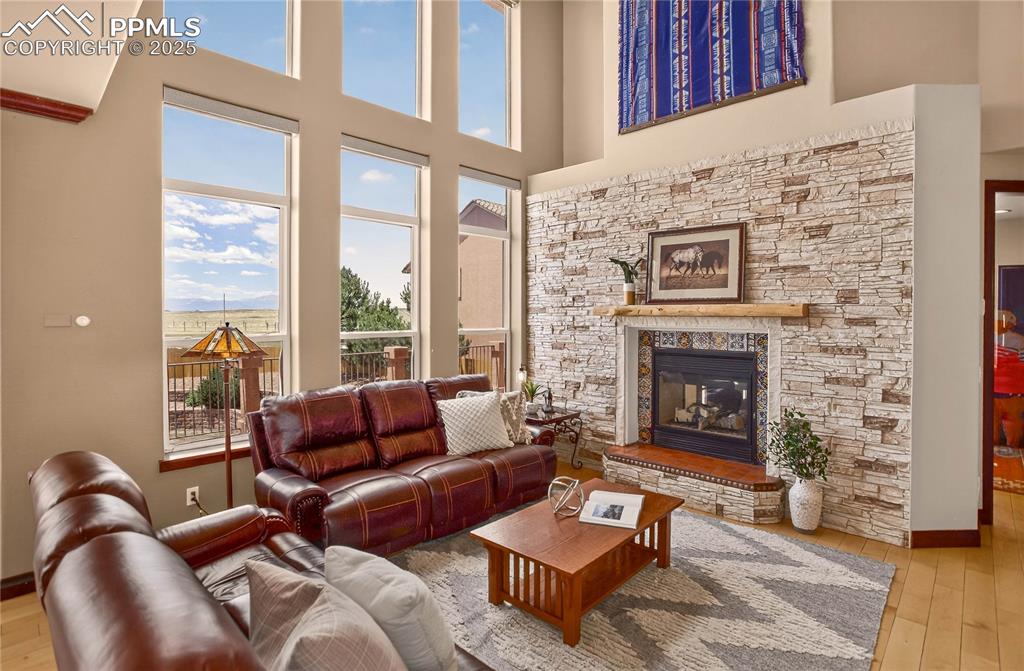Image 5 of 46: Double sided gas fireplace w/ beetle-kill pine mantle
