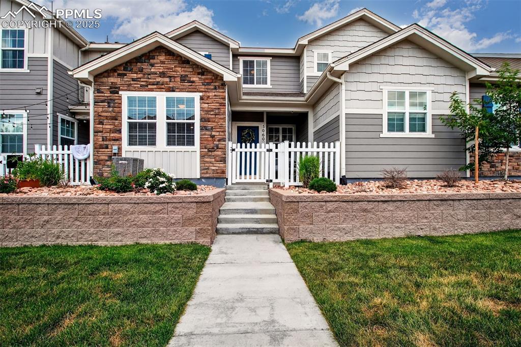 Caption: Beautifully upgraded townhome with gated front porch located in sought after Wolf Ranch.