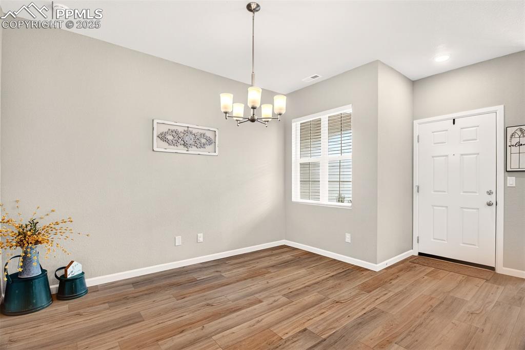 Image 10 of 29: Dining room as you enter from the covered front porch. 