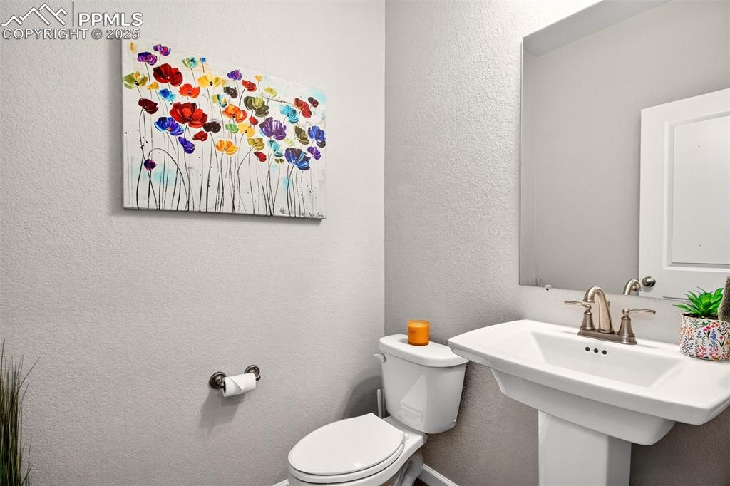 Image 11 of 29: Main level half bathroom. 