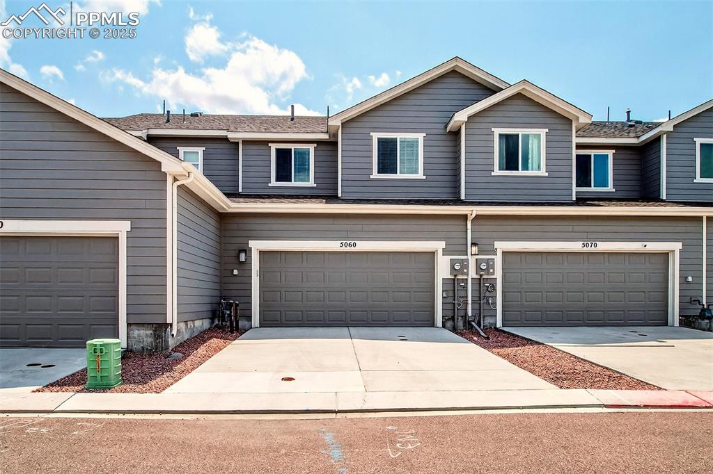 Image 23 of 29: Oversized 2 car garage with insulated door.
