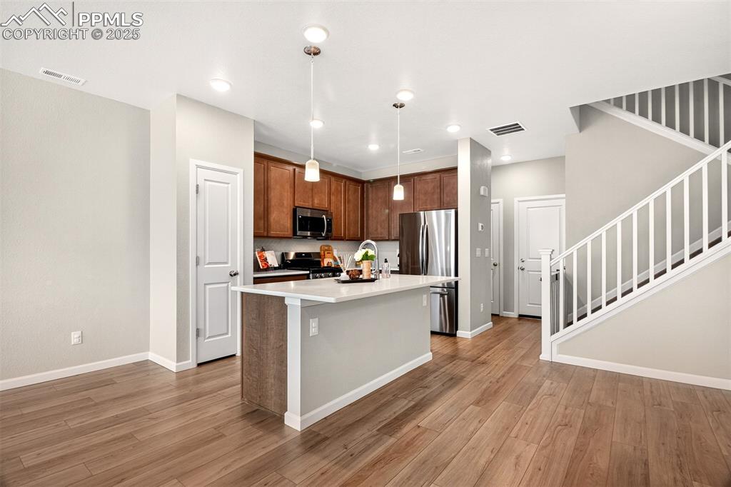 Image 4 of 29: Open and bright gourmet kitchen with 42" soft close cabinetry/drawers with 