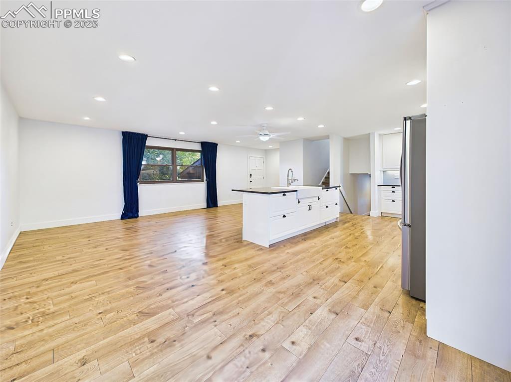 Image 16 of 50: Open main level offers abundant space and flexibility, with expansive windo